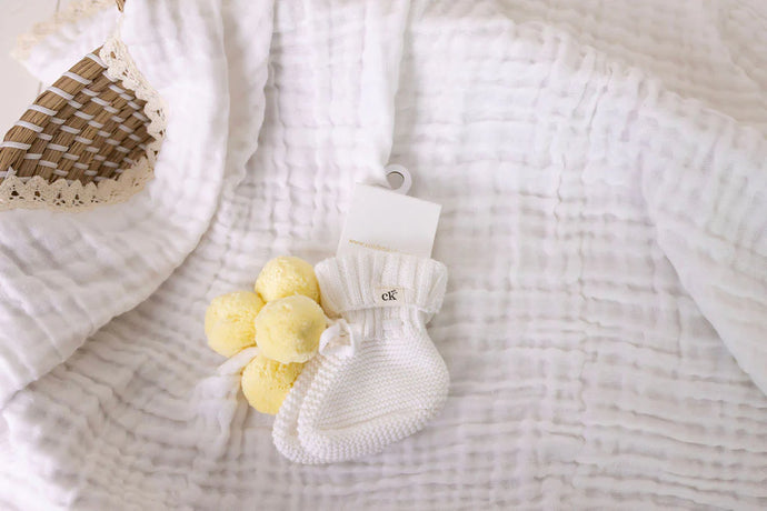 confetti kidz Knitted Booties | Snow + Yellow Pom Poms